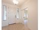Bright and airy entryway with wood-look floors at 18526 E Swan Dr, Queen Creek, AZ 85142