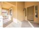 Front porch entry with a neutral-toned door and side windows at 18526 E Swan Dr, Queen Creek, AZ 85142
