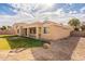 Single-story home with a covered patio and spacious backyard at 18526 E Swan Dr, Queen Creek, AZ 85142