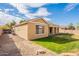 Tan house exterior with a landscaped yard and stone pathway at 18526 E Swan Dr, Queen Creek, AZ 85142