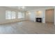 Spacious living room with fireplace and wood-look floors at 18526 E Swan Dr, Queen Creek, AZ 85142