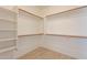 Spacious walk-in closet with ample shelving at 18526 E Swan Dr, Queen Creek, AZ 85142
