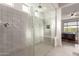 Spacious bathroom with glass shower enclosure and built-in bench at 21778 N 259Th Ln, Buckeye, AZ 85396
