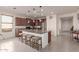 Modern kitchen with an island, granite countertops, and ample cabinetry at 21778 N 259Th Ln, Buckeye, AZ 85396