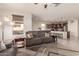 Open-concept living room with kitchen views and comfy sofas at 21778 N 259Th Ln, Buckeye, AZ 85396