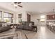 Open living space with a view into the kitchen and a cozy seating arrangement at 21778 N 259Th Ln, Buckeye, AZ 85396