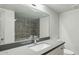 Bathroom with gray tile and modern vanity at 2227 E Catalina Dr, Phoenix, AZ 85016