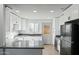Modern kitchen features gray countertops and white cabinets at 2227 E Catalina Dr, Phoenix, AZ 85016