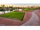Aerial view of a golf course with water features and homes at 23206 N Del Monte Dr, Sun City West, AZ 85375
