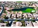 Community view with lake, golf course and homes at 23206 N Del Monte Dr, Sun City West, AZ 85375
