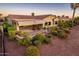Backyard patio with seating area and desert landscaping at 23206 N Del Monte Dr, Sun City West, AZ 85375