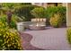 Landscaped backyard with fire pit and seating area at 23206 N Del Monte Dr, Sun City West, AZ 85375