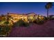 Landscaped backyard with patio and lighting at 23206 N Del Monte Dr, Sun City West, AZ 85375
