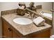 Modern bathroom vanity with granite countertop and sink at 23206 N Del Monte Dr, Sun City West, AZ 85375