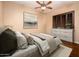 Spacious bedroom with hardwood floors and large window with shutters at 23206 N Del Monte Dr, Sun City West, AZ 85375