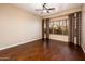 Bright bedroom with hardwood floors and a large window at 23206 N Del Monte Dr, Sun City West, AZ 85375