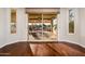 Bright bedroom featuring hardwood floors and access to a patio at 23206 N Del Monte Dr, Sun City West, AZ 85375