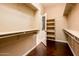 Spacious walk-in closet offering custom shelving and hanging rods at 23206 N Del Monte Dr, Sun City West, AZ 85375