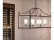 Elegant chandelier illuminates the dining room, adding a touch of sophistication at 23206 N Del Monte Dr, Sun City West, AZ 85375