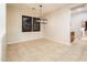 Spacious dining room featuring tile floors and large windows with shutters at 23206 N Del Monte Dr, Sun City West, AZ 85375