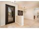 Elegant entryway with iron door and tile flooring at 23206 N Del Monte Dr, Sun City West, AZ 85375