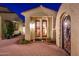 Private courtyard entry with wrought iron gate and brick pavers at 23206 N Del Monte Dr, Sun City West, AZ 85375