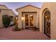 Private courtyard entry with wrought iron gate and brick pavers at 23206 N Del Monte Dr, Sun City West, AZ 85375