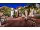 Landscaped front yard with palm trees and a gated entryway at 23206 N Del Monte Dr, Sun City West, AZ 85375
