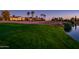 Golf course view at dusk with water features and homes in the background at 23206 N Del Monte Dr, Sun City West, AZ 85375
