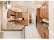 Large kitchen featuring ample cabinetry and a kitchen island at 23206 N Del Monte Dr, Sun City West, AZ 85375