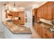Open kitchen with granite counters, a breakfast bar, and stainless steel appliances at 23206 N Del Monte Dr, Sun City West, AZ 85375