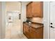Functional kitchenette featuring wooden cabinets and granite countertop at 23206 N Del Monte Dr, Sun City West, AZ 85375