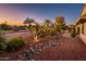 Landscaped yard with rock features and pathway at 23206 N Del Monte Dr, Sun City West, AZ 85375