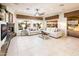 Living room with fireplace, built-ins, and view to patio at 23206 N Del Monte Dr, Sun City West, AZ 85375