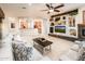 Living room with kitchen view and built-ins at 23206 N Del Monte Dr, Sun City West, AZ 85375