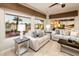 Living area with comfy sofas and backyard view at 23206 N Del Monte Dr, Sun City West, AZ 85375