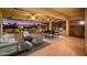 Covered patio with comfortable seating and outdoor kitchen at 23206 N Del Monte Dr, Sun City West, AZ 85375