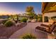 Relaxing patio with fire pit and lounge chairs at 23206 N Del Monte Dr, Sun City West, AZ 85375