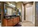 Spacious bathroom features a double vanity and large mirror at 26398 W Cat Balue Dr, Buckeye, AZ 85396