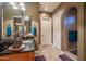 Bathroom with walk-in shower, double vanity, and tiled floor at 26398 W Cat Balue Dr, Buckeye, AZ 85396