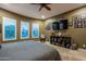 Serene bedroom with large TV and ample storage at 26398 W Cat Balue Dr, Buckeye, AZ 85396