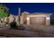 Single-story home with desert landscaping and a two-car garage at 26398 W Cat Balue Dr, Buckeye, AZ 85396