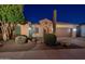 Night view of a single-story home with desert landscaping and a two-car garage at 26398 W Cat Balue Dr, Buckeye, AZ 85396