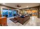 Living area with sliding glass doors opening to backyard oasis at 26398 W Cat Balue Dr, Buckeye, AZ 85396