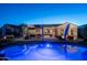 Inviting backyard oasis with a pool, patio, and fire pit at 26398 W Cat Balue Dr, Buckeye, AZ 85396