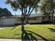 Single-story home with a well-maintained lawn and attached garage at 2927 W Glenn Dr, Phoenix, AZ 85051