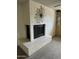 Close up of the white brick fireplace with hearth at 2927 W Glenn Dr, Phoenix, AZ 85051