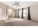 Primary bedroom with ensuite bathroom and ceiling fan at 3109 E Denim Trl, San Tan Valley, AZ 85143