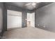 Bedroom with gray walls, ceiling fan, and walk-in closet at 3109 E Denim Trl, San Tan Valley, AZ 85143