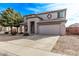 Two-story house with a large tree and desert landscaping at 3109 E Denim Trl, San Tan Valley, AZ 85143